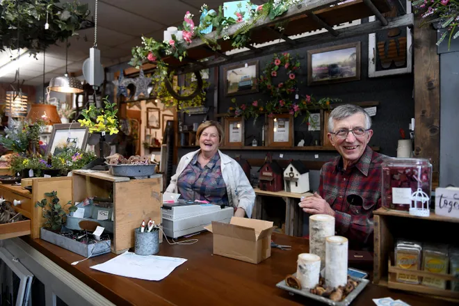 Small business owners at their shop counter